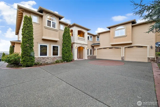 a front view of a house with large windows