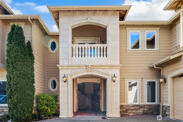 an aerial view of a house with a ocean view