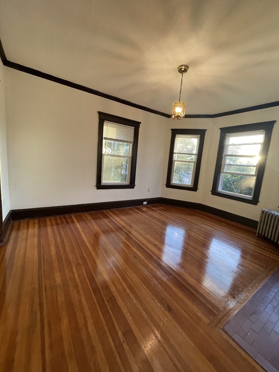 20 Glade Avenue, Unit 3 Boston, MA 02130 - Photo 2 of 9 wooden floor in an empty room with a window