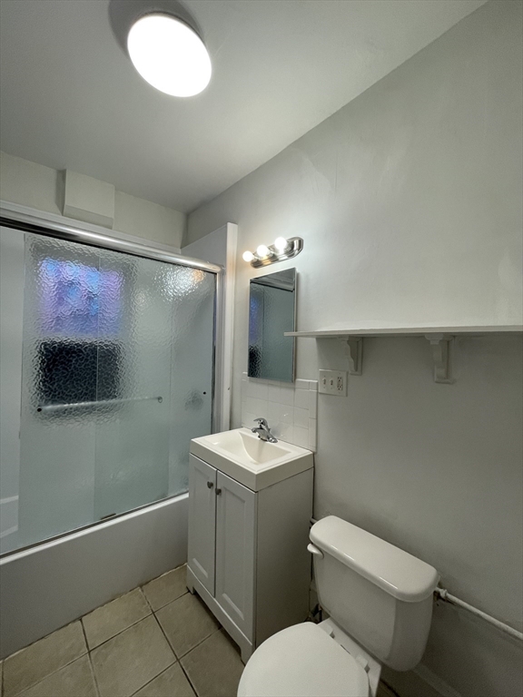 20 Glade Avenue, Unit 3 Boston, MA 02130 - Photo 9 of 9 a bathroom with a toilet sink and mirror