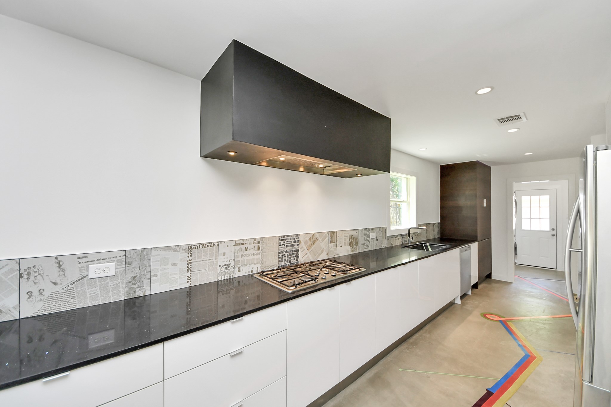 7610 Highmeadow Drive Houston, TX 77063 - Photo 20 of 50 a kitchen with granite countertop a sink and a stove top oven