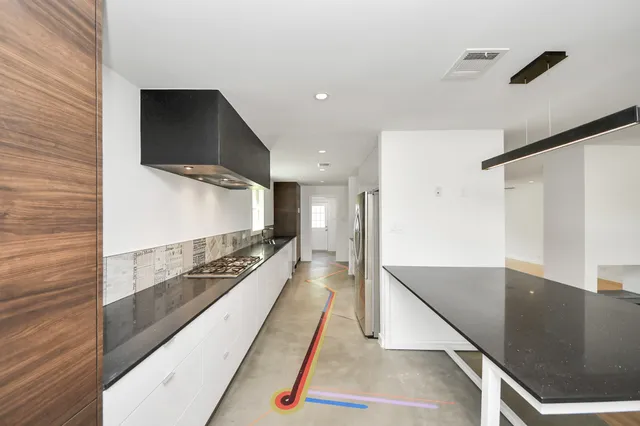 a bathroom with a sink and a large mirror
