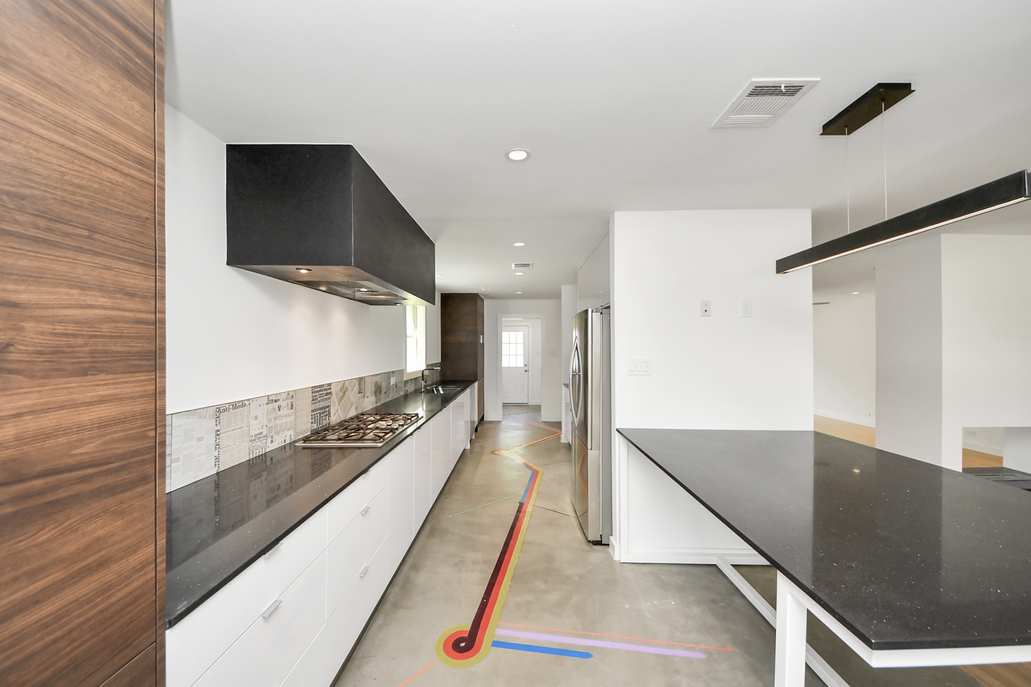 7610 Highmeadow Drive Houston, TX 77063 - Photo 22 of 50 a bathroom with a sink and a large mirror