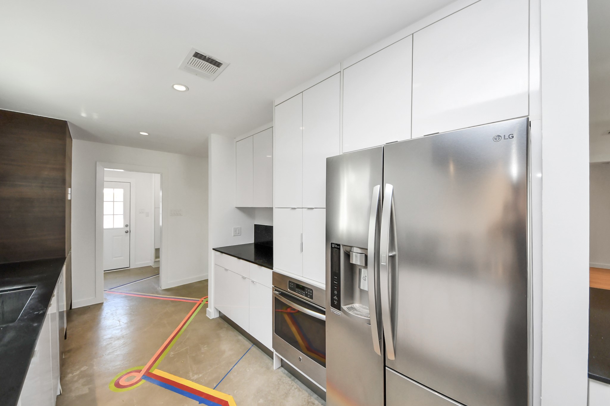 7610 Highmeadow Drive Houston, TX 77063 - Photo 31 of 50 a kitchen with stainless steel appliances granite countertop a refrigerator and a stove