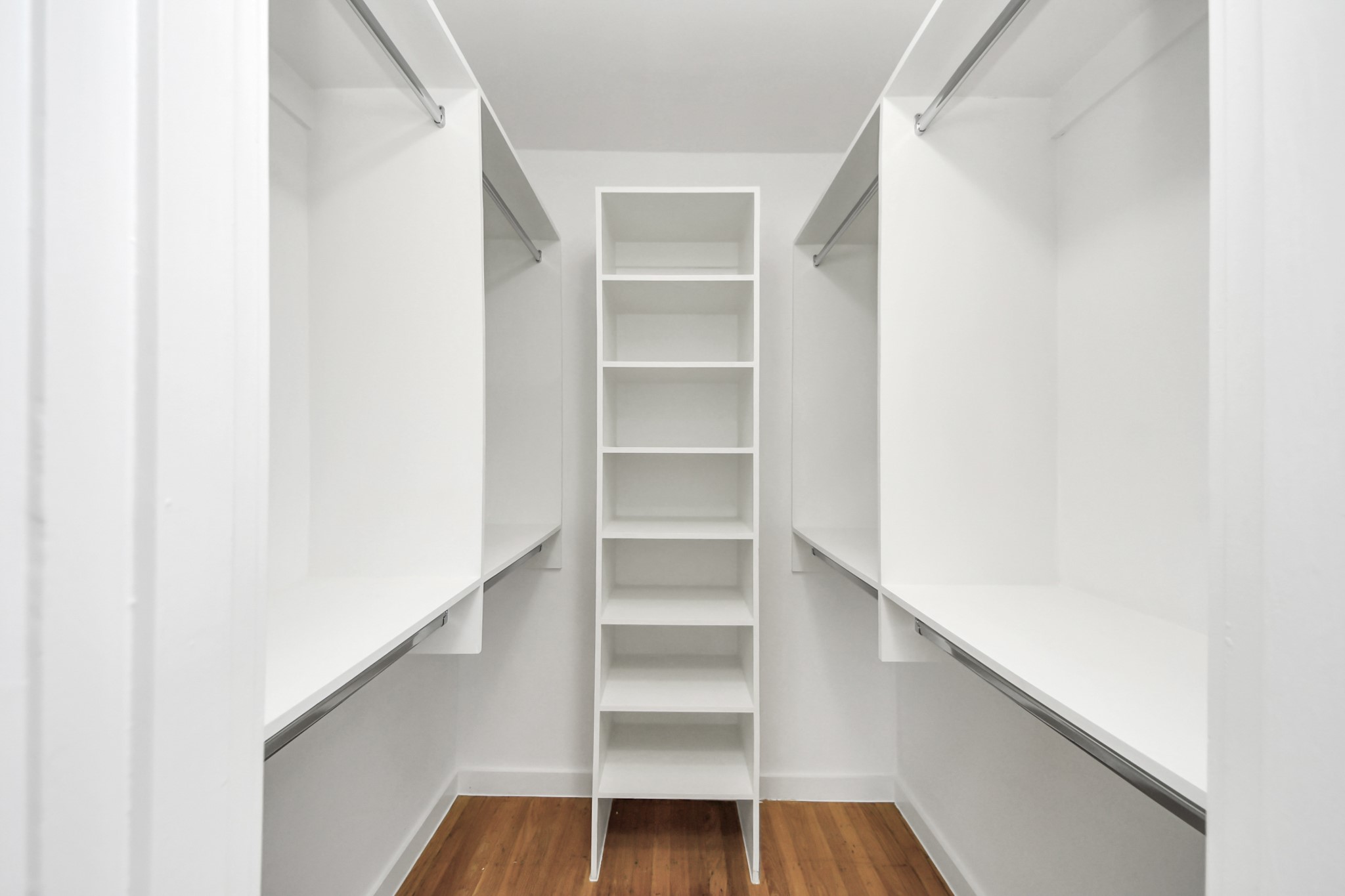 7610 Highmeadow Drive Houston, TX 77063 - Photo 37 of 50 a view of walk in closet with empty racks