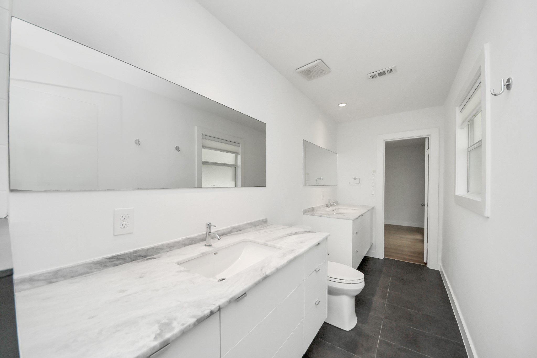 7610 Highmeadow Drive Houston, TX 77063 - Photo 43 of 50 a bathroom with a granite countertop sink and a mirror