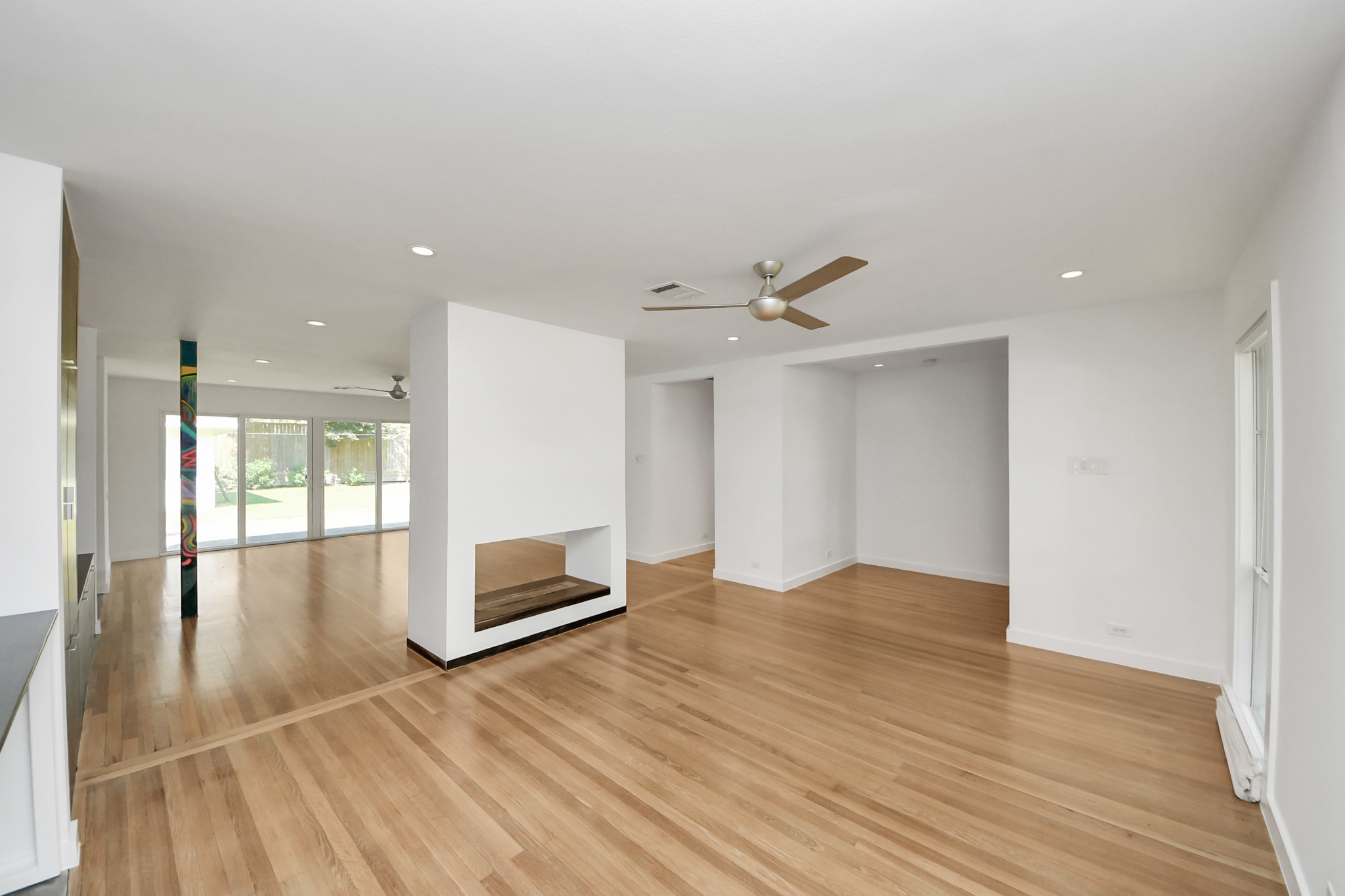 7610 Highmeadow Drive Houston, TX 77063 - Photo 45 of 50 a view of an empty room with wooden floor and a window