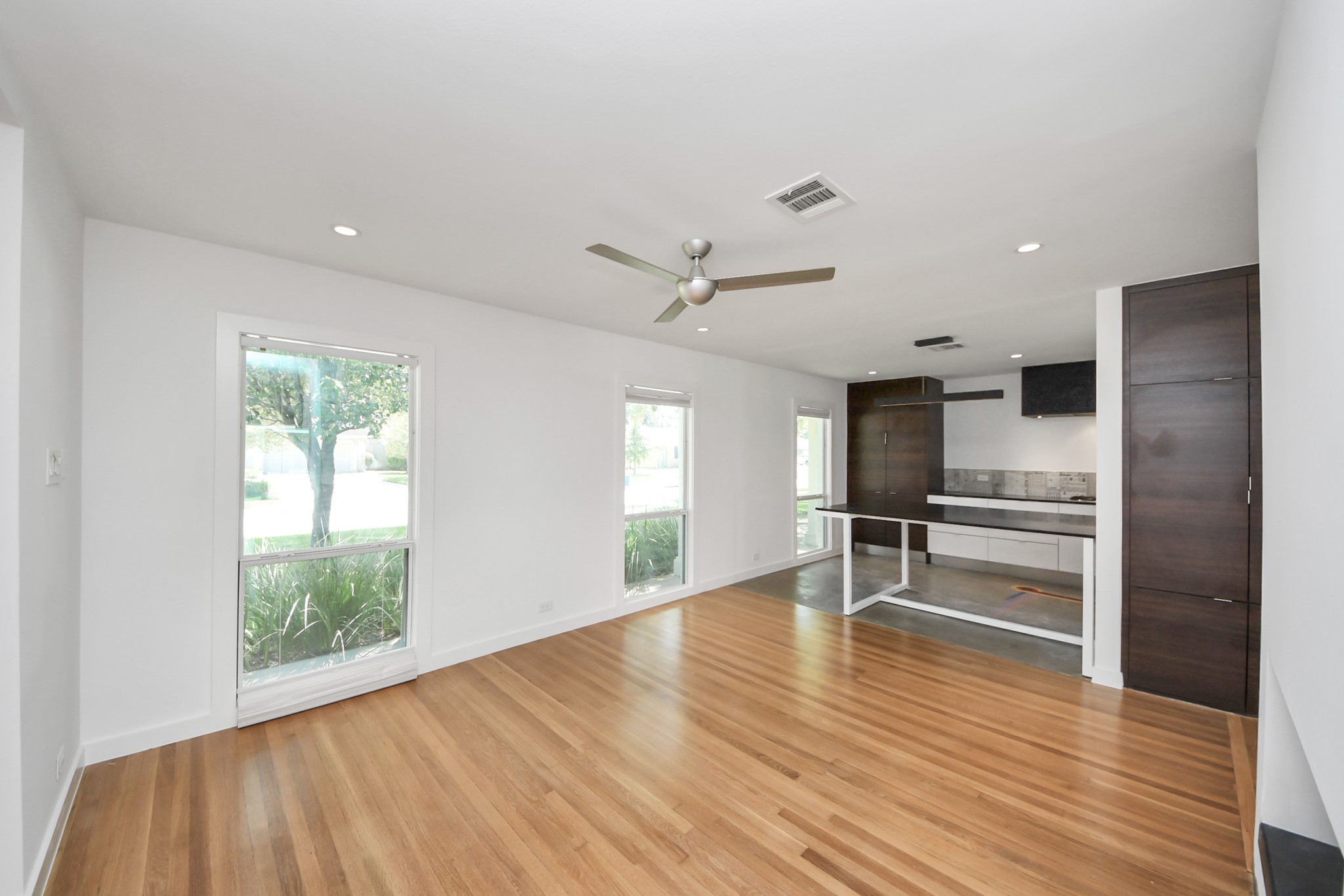 7610 Highmeadow Drive Houston, TX 77063 - Photo 46 of 50 a view of empty room with wooden floor and window