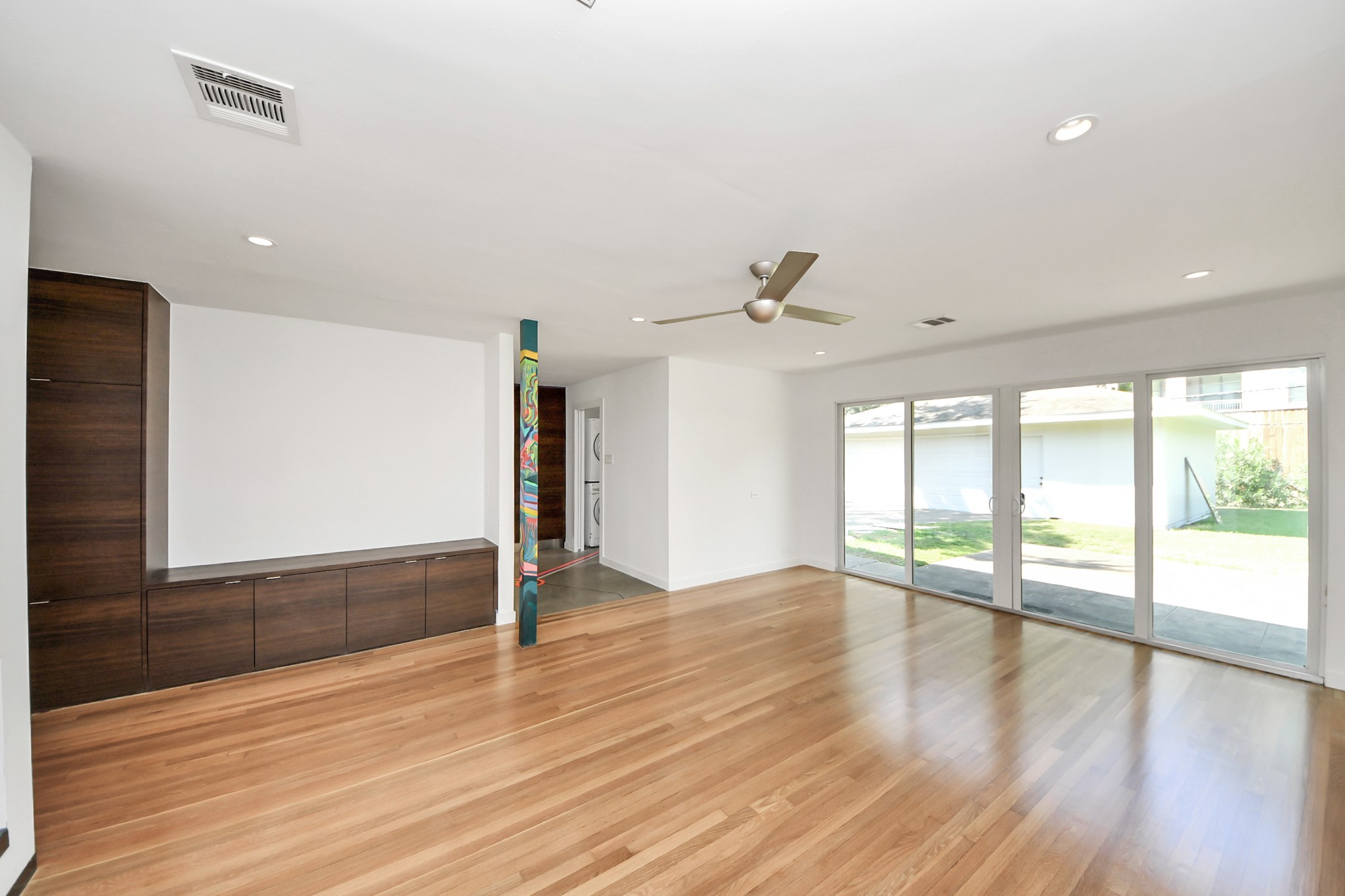 7610 Highmeadow Drive Houston, TX 77063 - Photo 47 of 50 a view of an empty room with wooden floor and a window