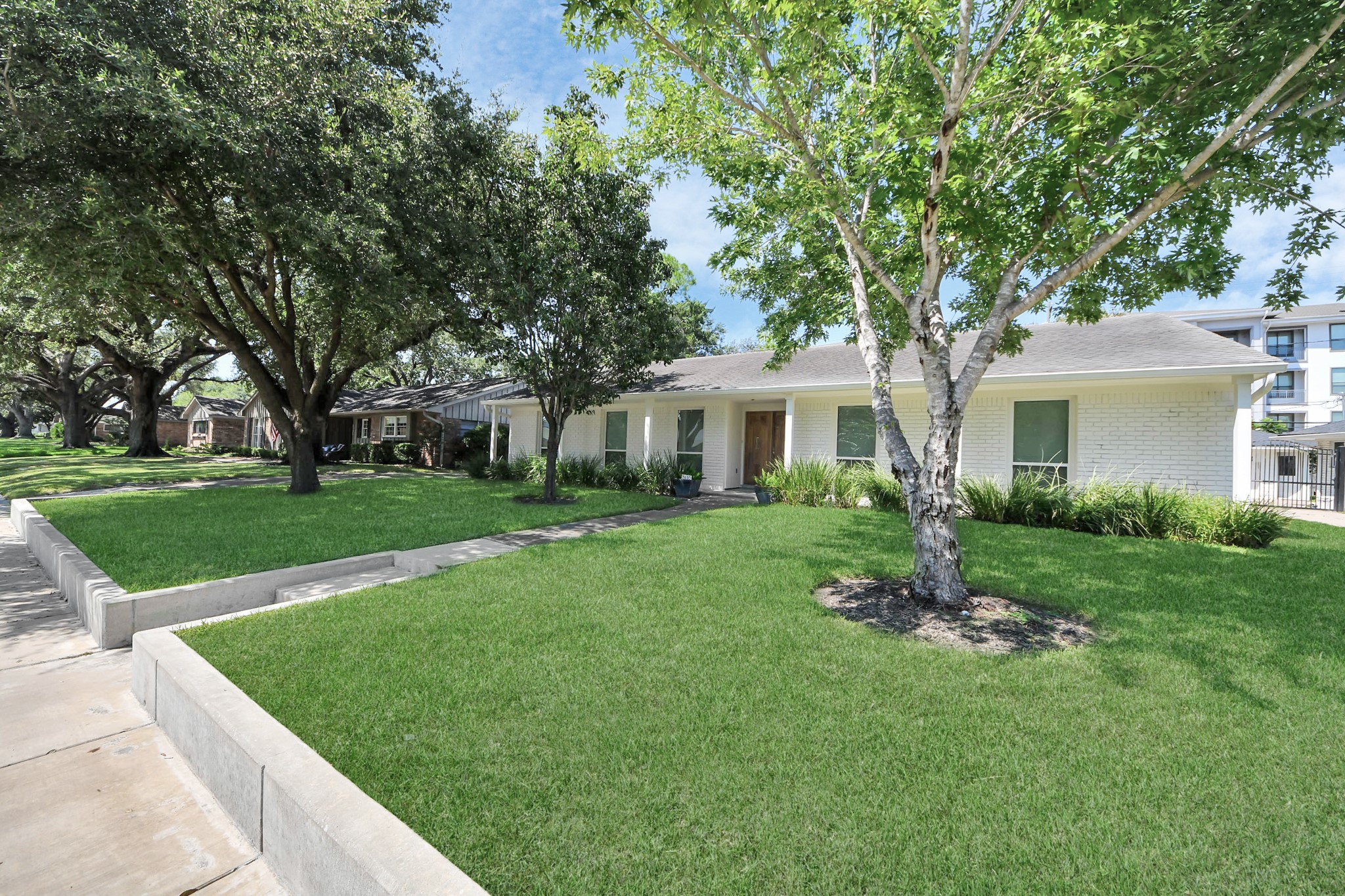 7610 Highmeadow Drive Houston, TX 77063 - Photo 6 of 50 a front view of house with yard and green space