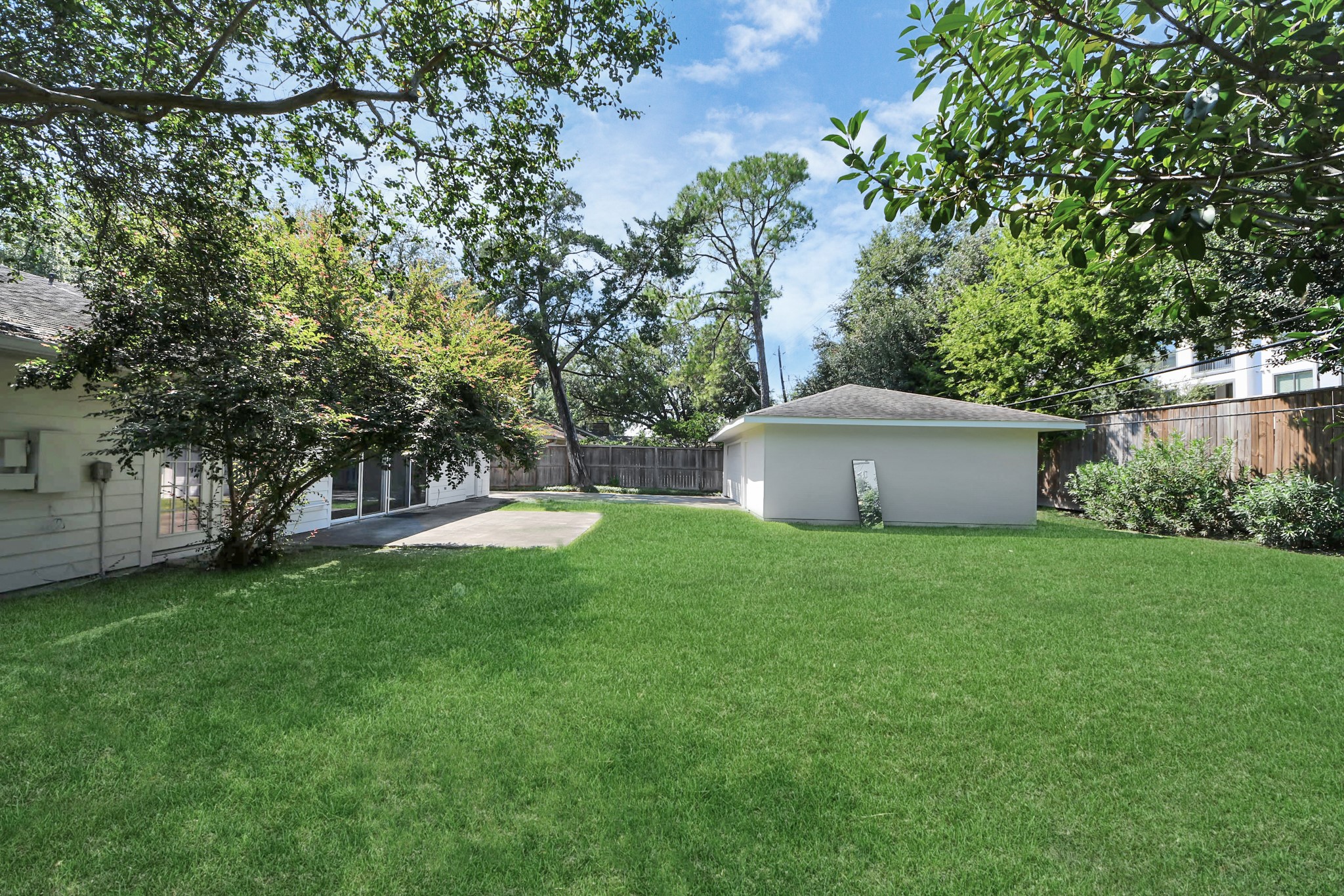 7610 Highmeadow Drive Houston, TX 77063 - Photo 7 of 50 a view of a house with a yard and a large tree