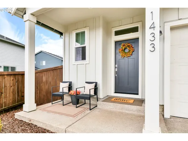 a view of a livingroom with furniture and a window