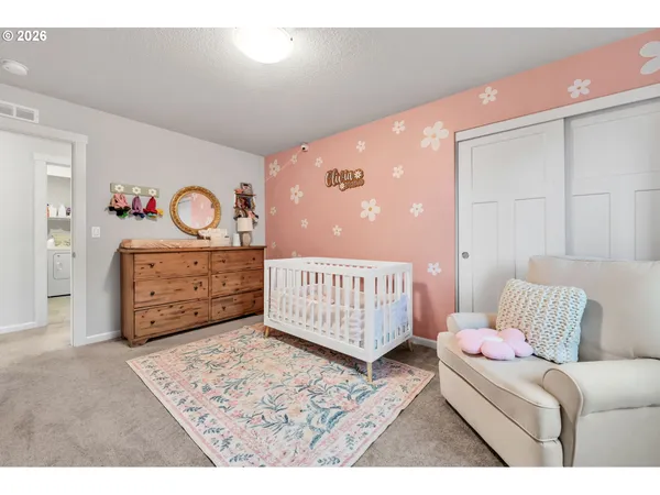 a living room with furniture and a book shelf