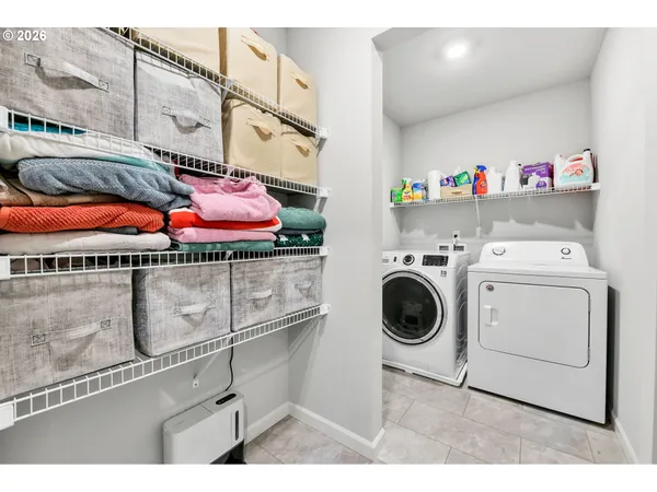 a bedroom with a large bed and a large window