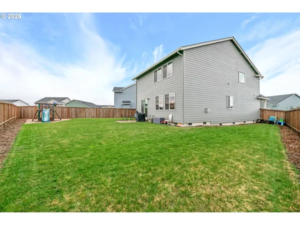 a front view of house with yard and outdoor seating