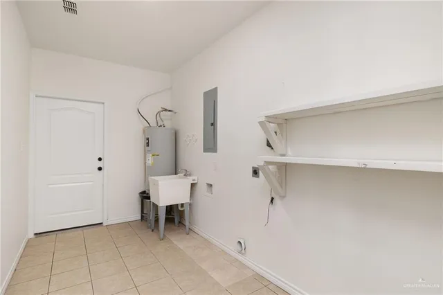 an empty room with windows and ceiling fan