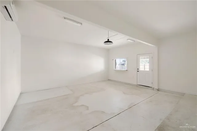 a view of a house with a yard and large tree