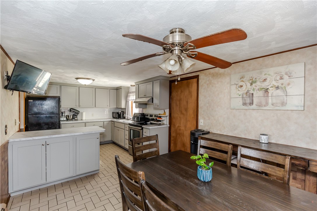 60 Ruskin Avenue Woonsocket, RI 02895 - Photo 7 of 31 1st Floor Kitchen & Dining Area