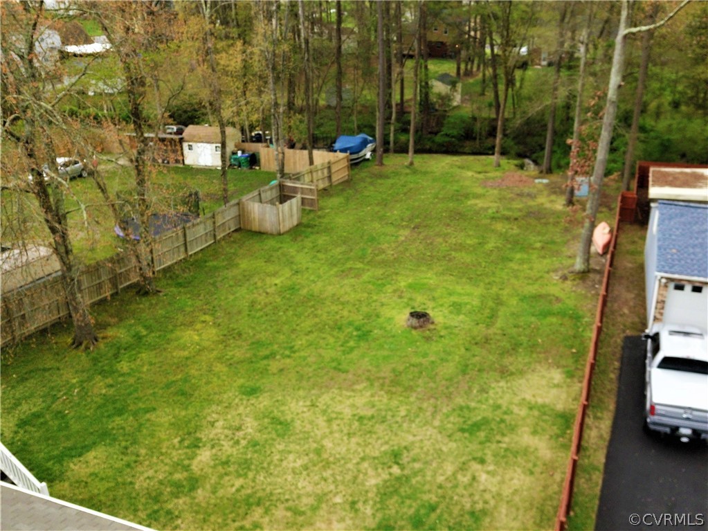 9525 Kennesaw Road Chesterfield, VA 23236 - Photo 3 of 28 a backyard of a house with lots of green space and fountain
