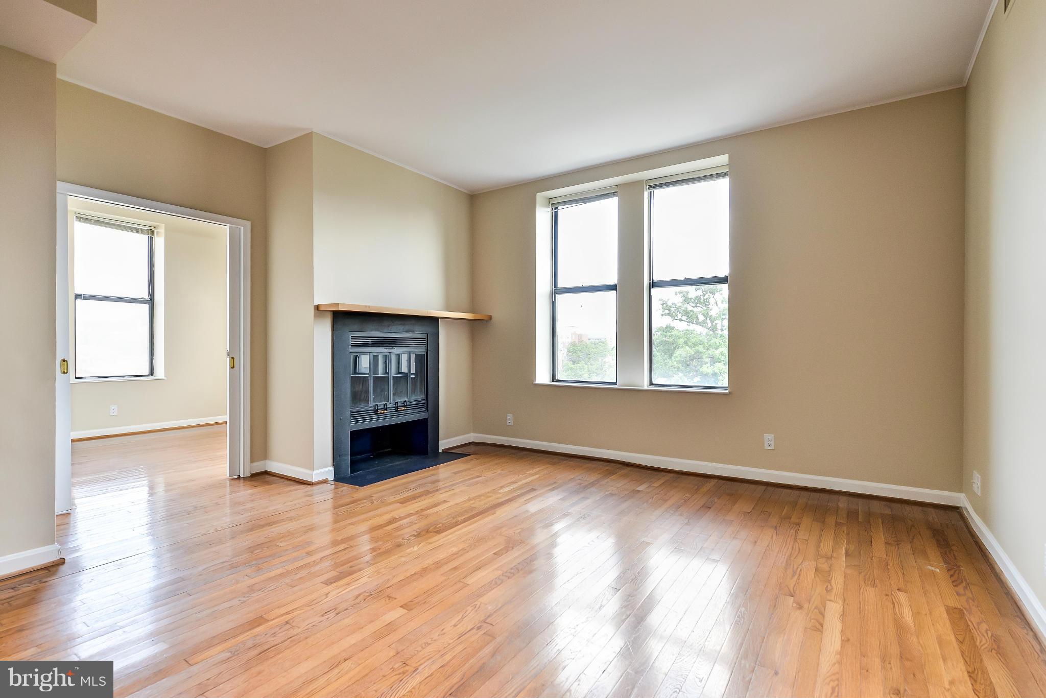 1830 17th Street Northwest, Unit 606 Washington, DC 20009 - Photo 6 of 26 Living Room-YES that's a wood-burning fireplace