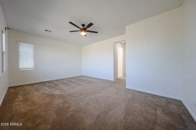 a view of a big room with carpet
