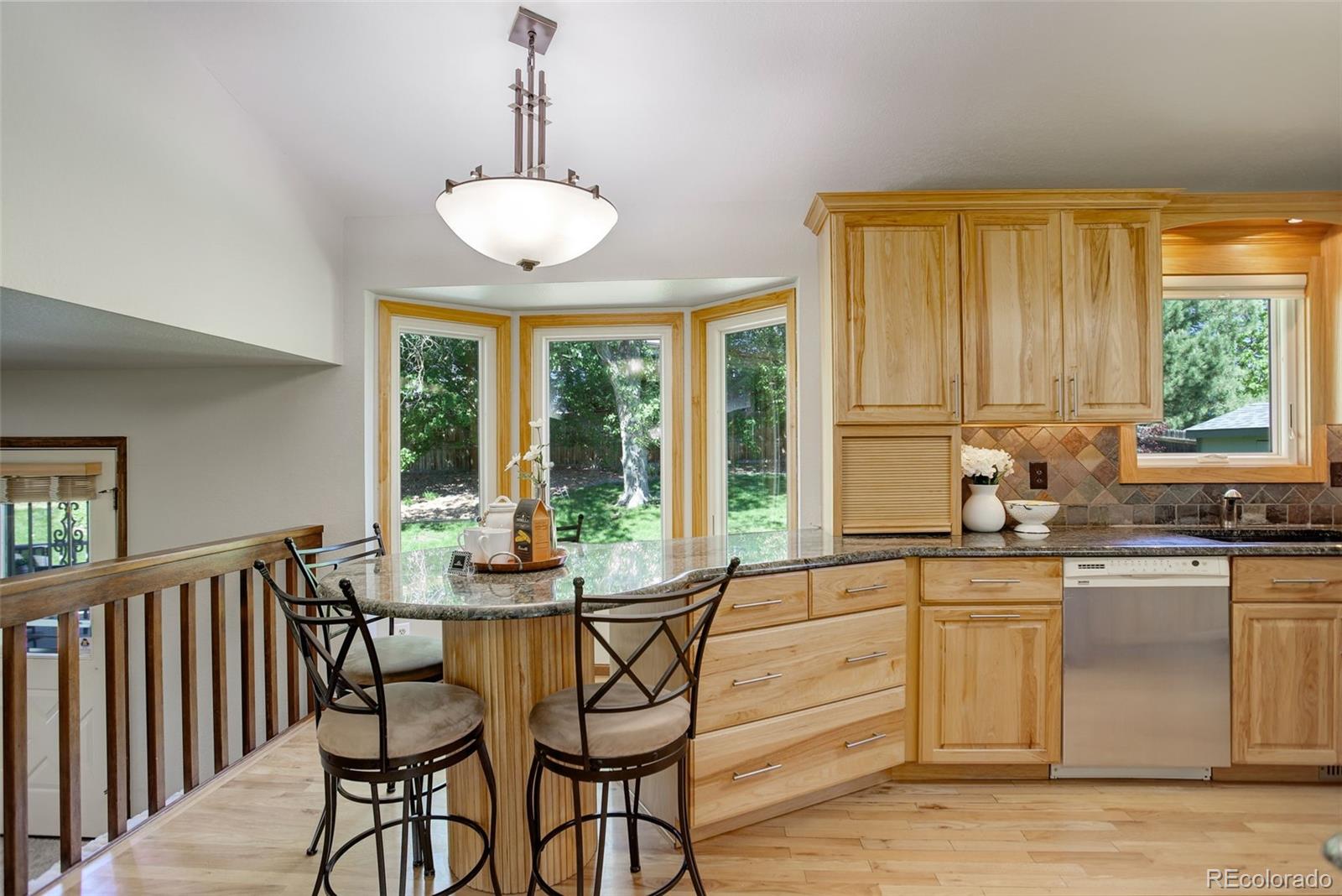 7877 West 110th Drive Westminster, CO 80021 - Photo 13 of 46 a view of a dining room with furniture window and outside view