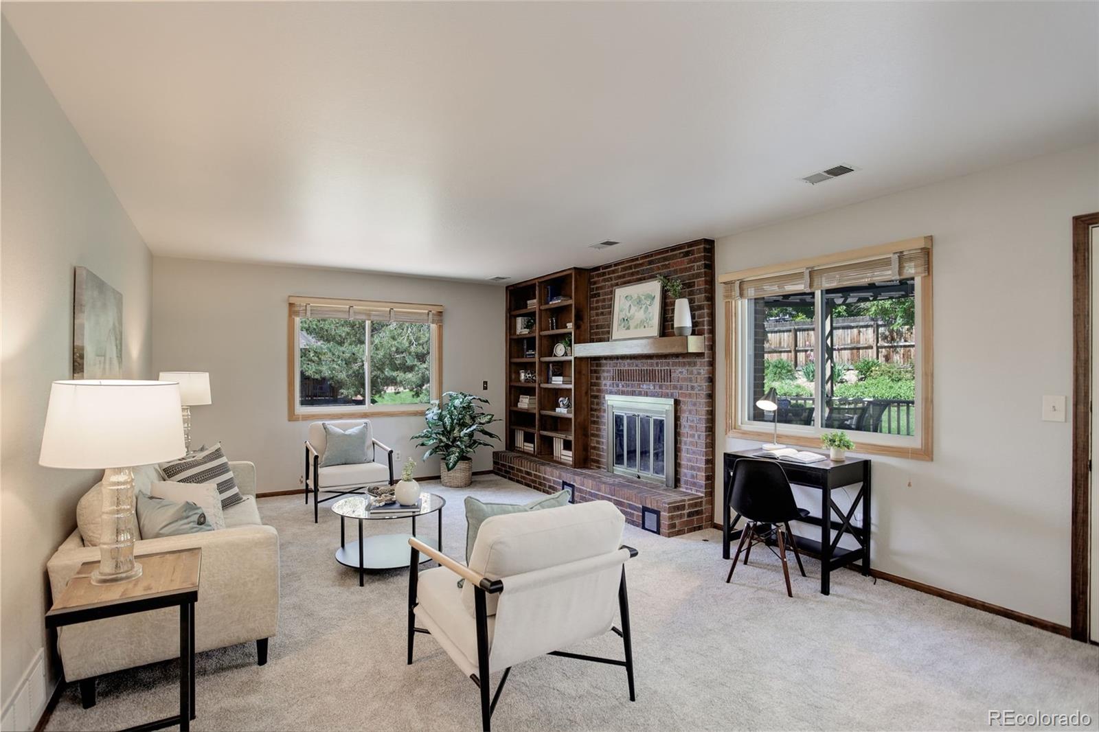 7877 West 110th Drive Westminster, CO 80021 - Photo 15 of 46 a living room with furniture and a window