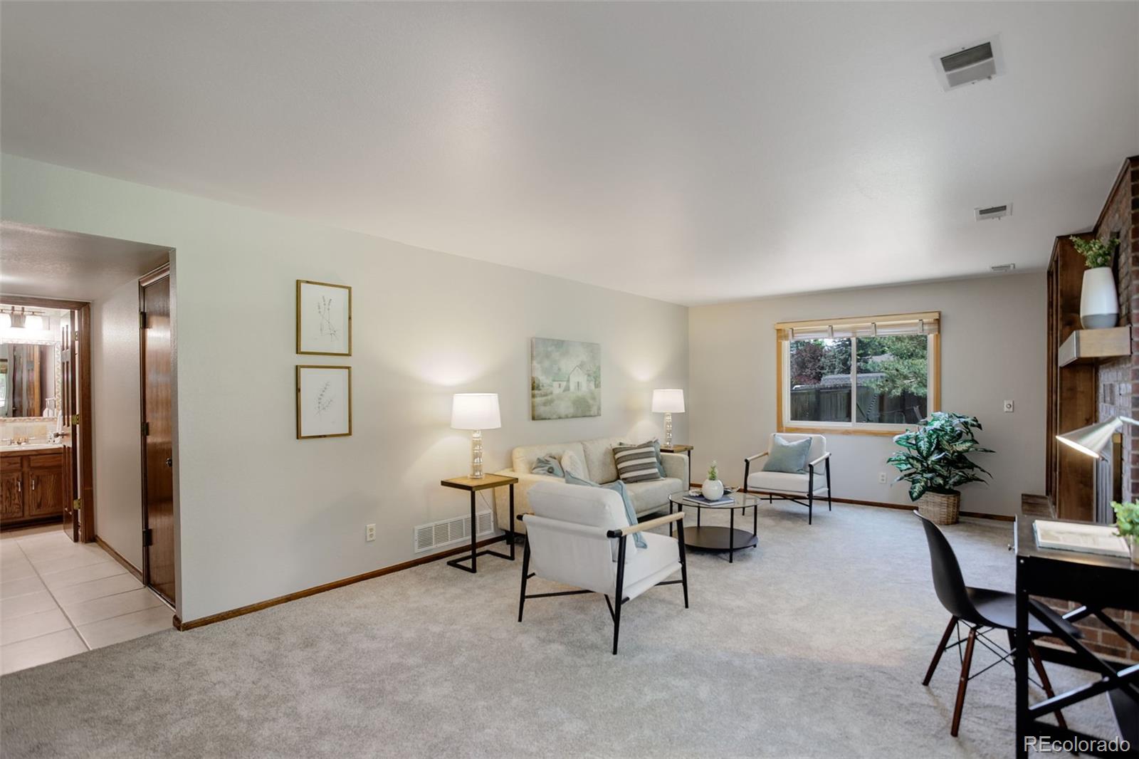 7877 West 110th Drive Westminster, CO 80021 - Photo 16 of 46 a living room with furniture and a window