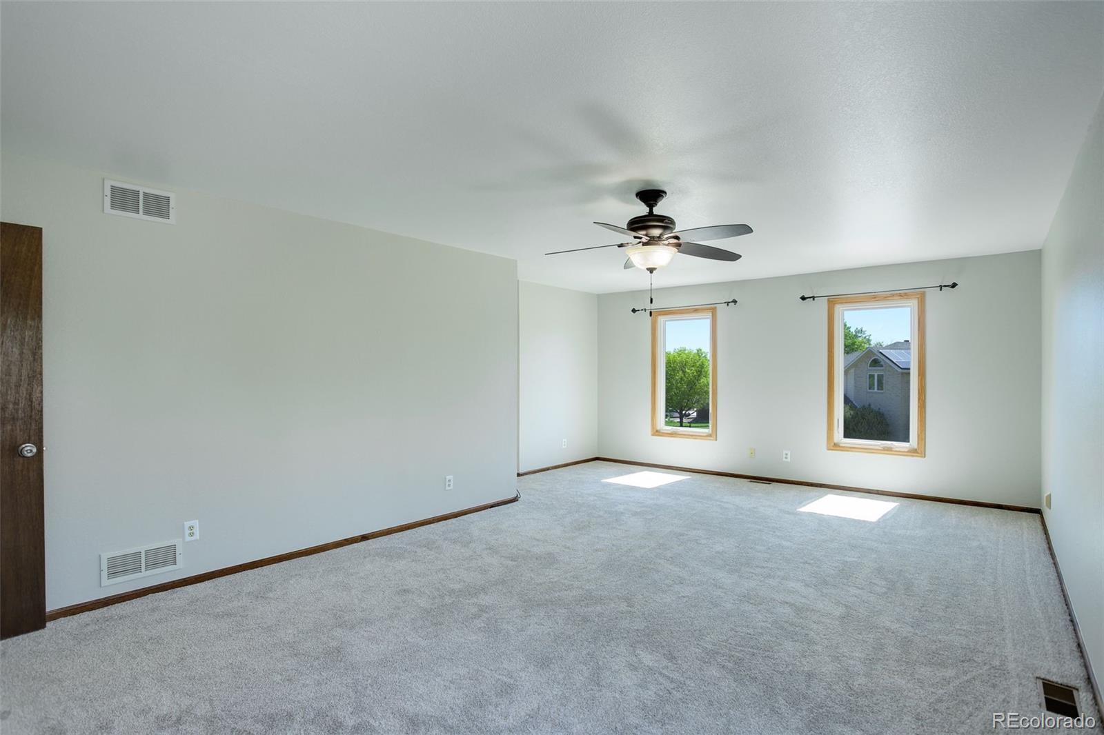 7877 West 110th Drive Westminster, CO 80021 - Photo 22 of 46 an empty room with window