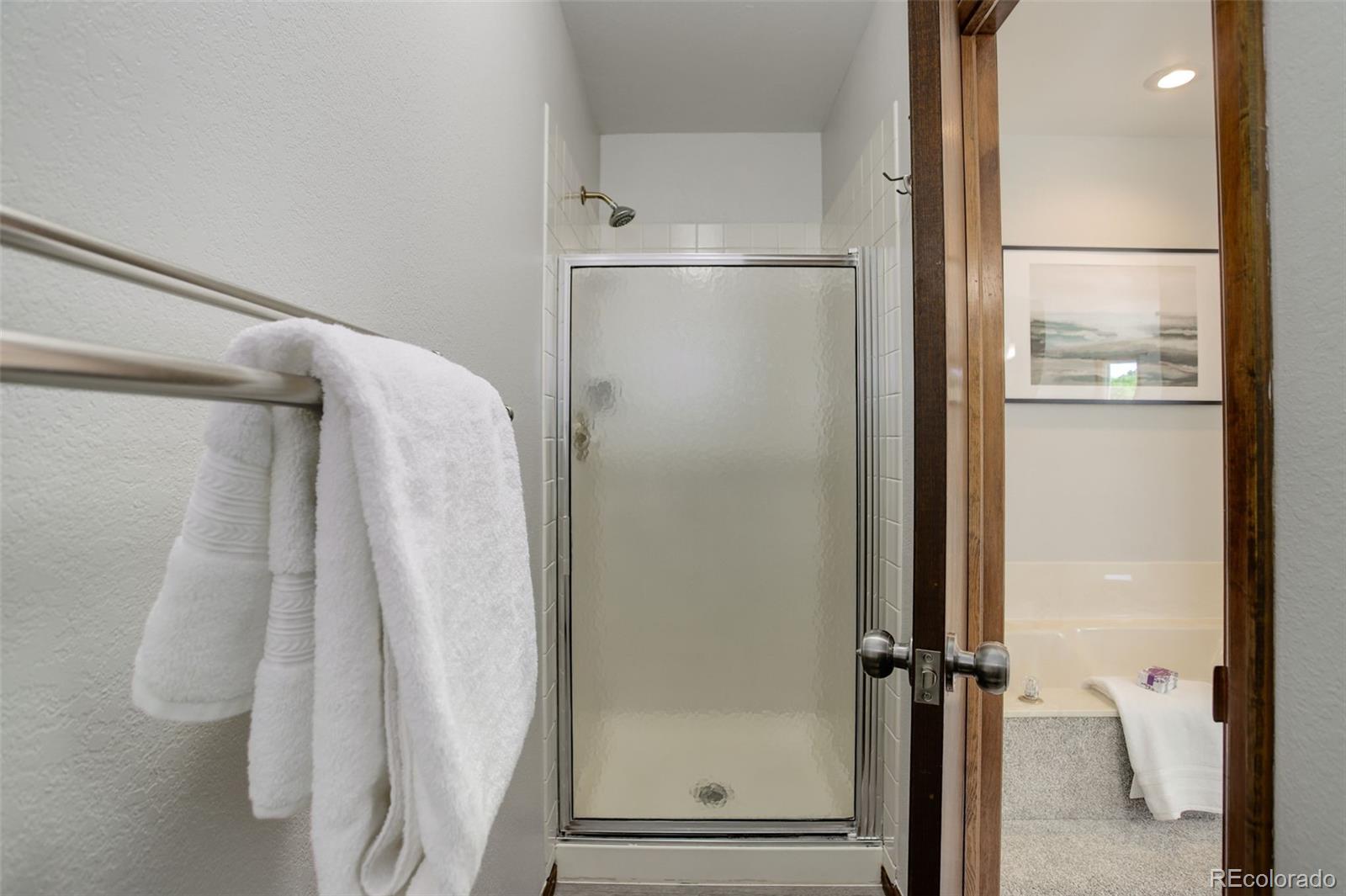 7877 West 110th Drive Westminster, CO 80021 - Photo 25 of 46 a bathroom with a shower
