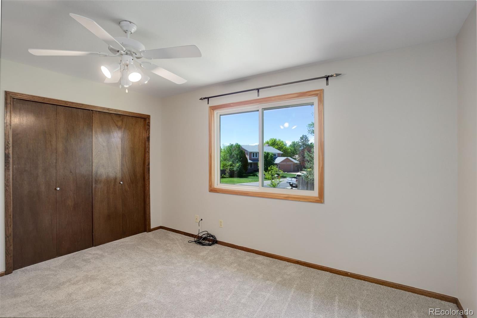 7877 West 110th Drive Westminster, CO 80021 - Photo 27 of 46 a view of an empty room with a window