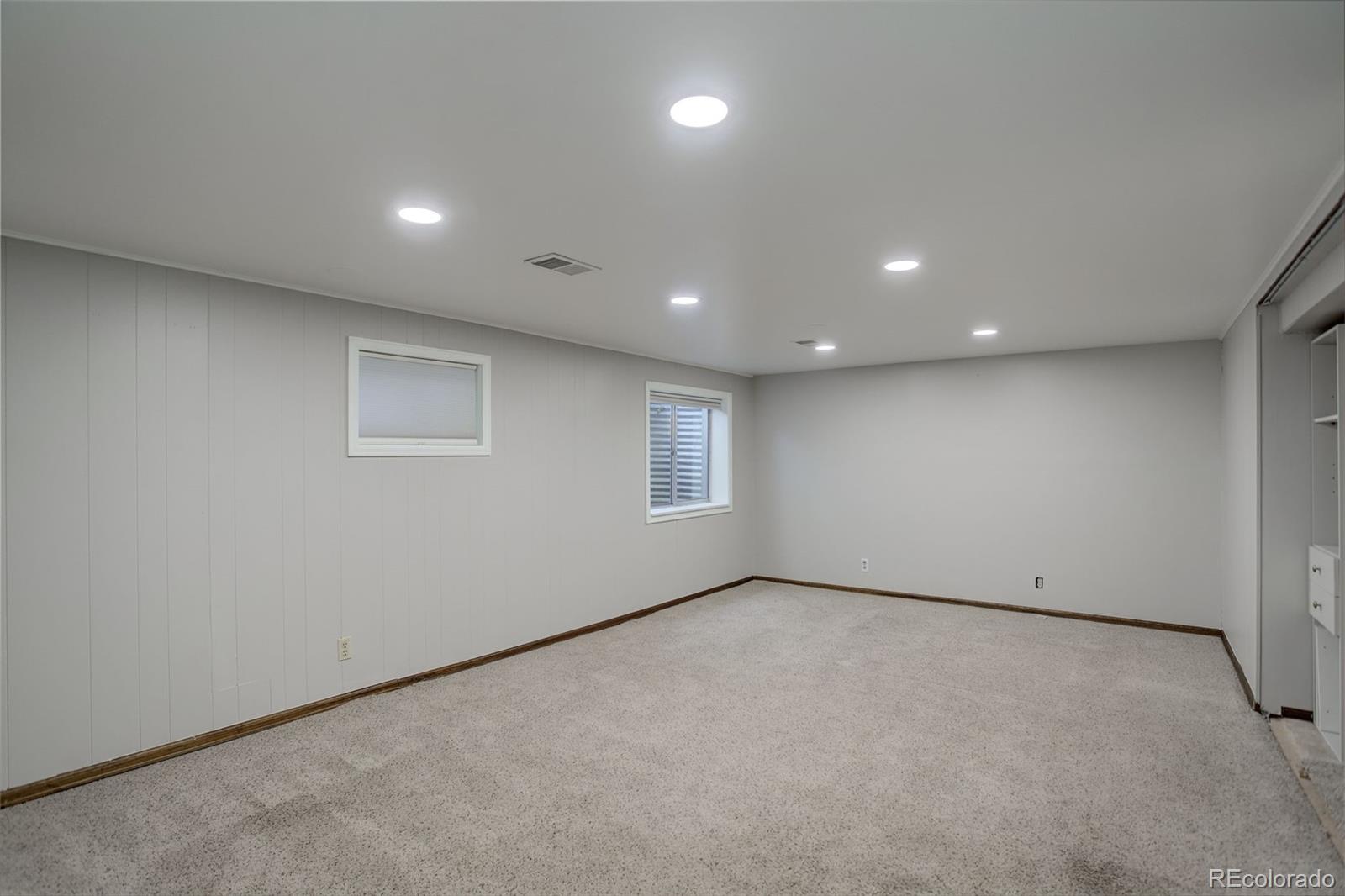 7877 West 110th Drive Westminster, CO 80021 - Photo 29 of 46 an empty room with a empty space and windows
