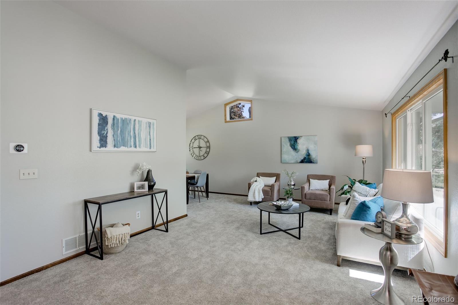 7877 West 110th Drive Westminster, CO 80021 - Photo 3 of 46 a living room with furniture and a window