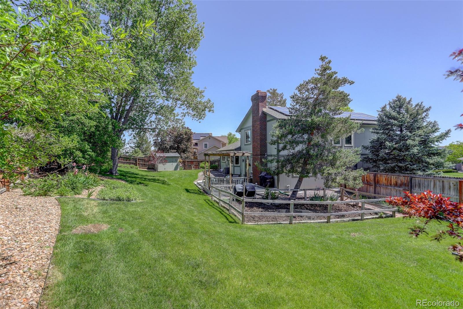7877 West 110th Drive Westminster, CO 80021 - Photo 36 of 46 a view of a backyard with sitting area