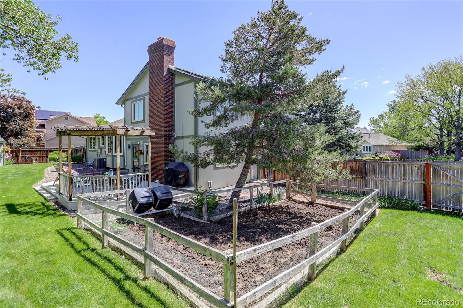 7877 West 110th Drive Westminster, CO 80021 - Photo 37 of 46 a view of a garden with sitting area