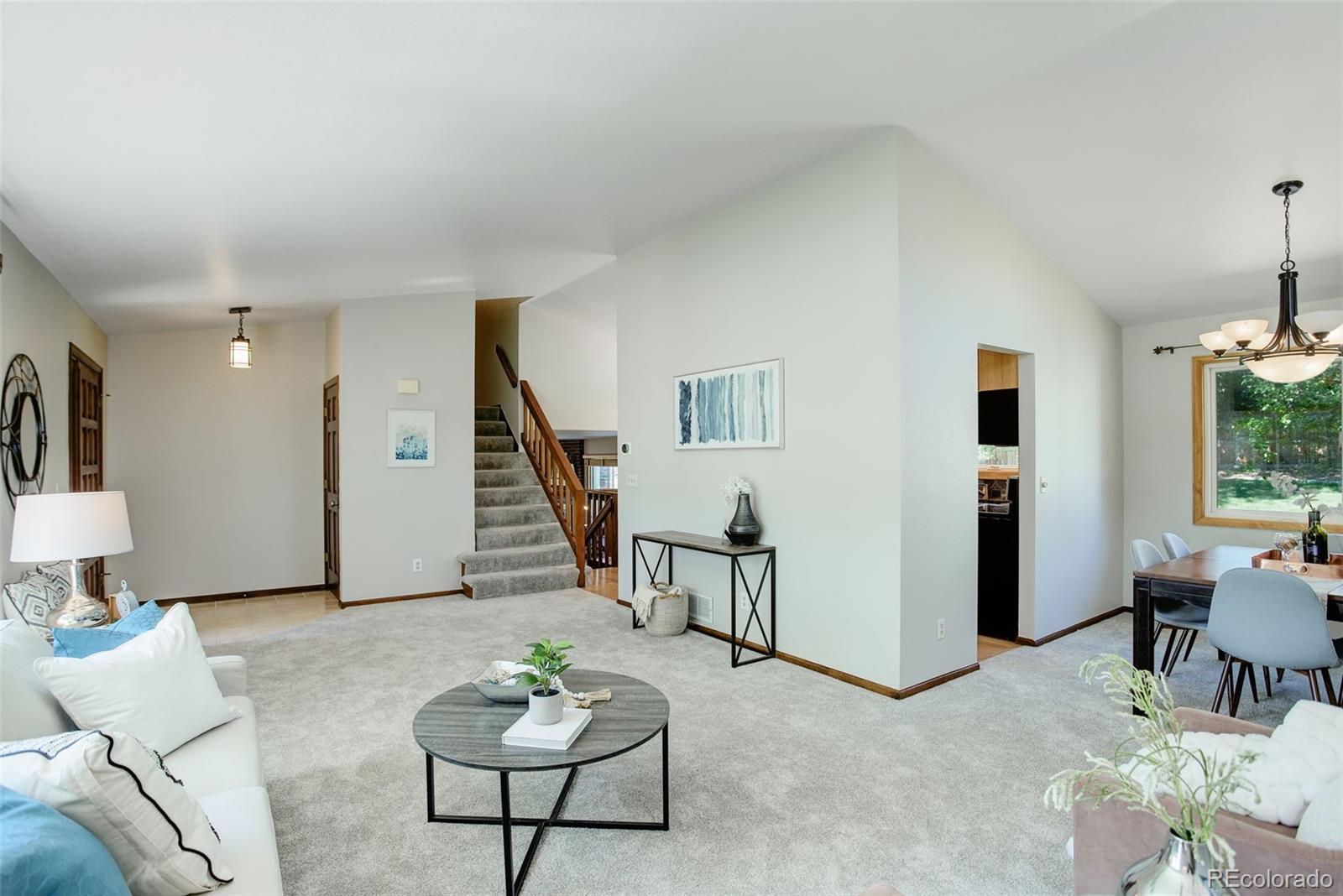 7877 West 110th Drive Westminster, CO 80021 - Photo 6 of 46 a living room with furniture and wooden floor