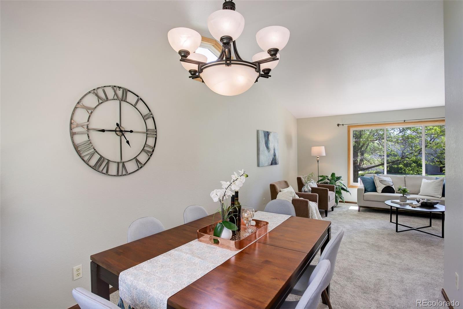 7877 West 110th Drive Westminster, CO 80021 - Photo 7 of 46 a view of a dining room with furniture window and outside view