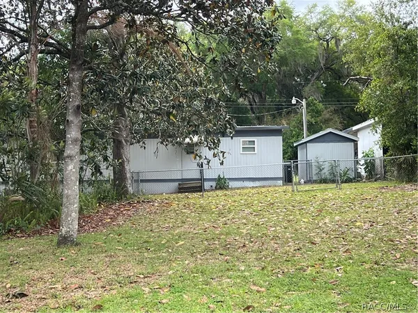a house with trees in front of it