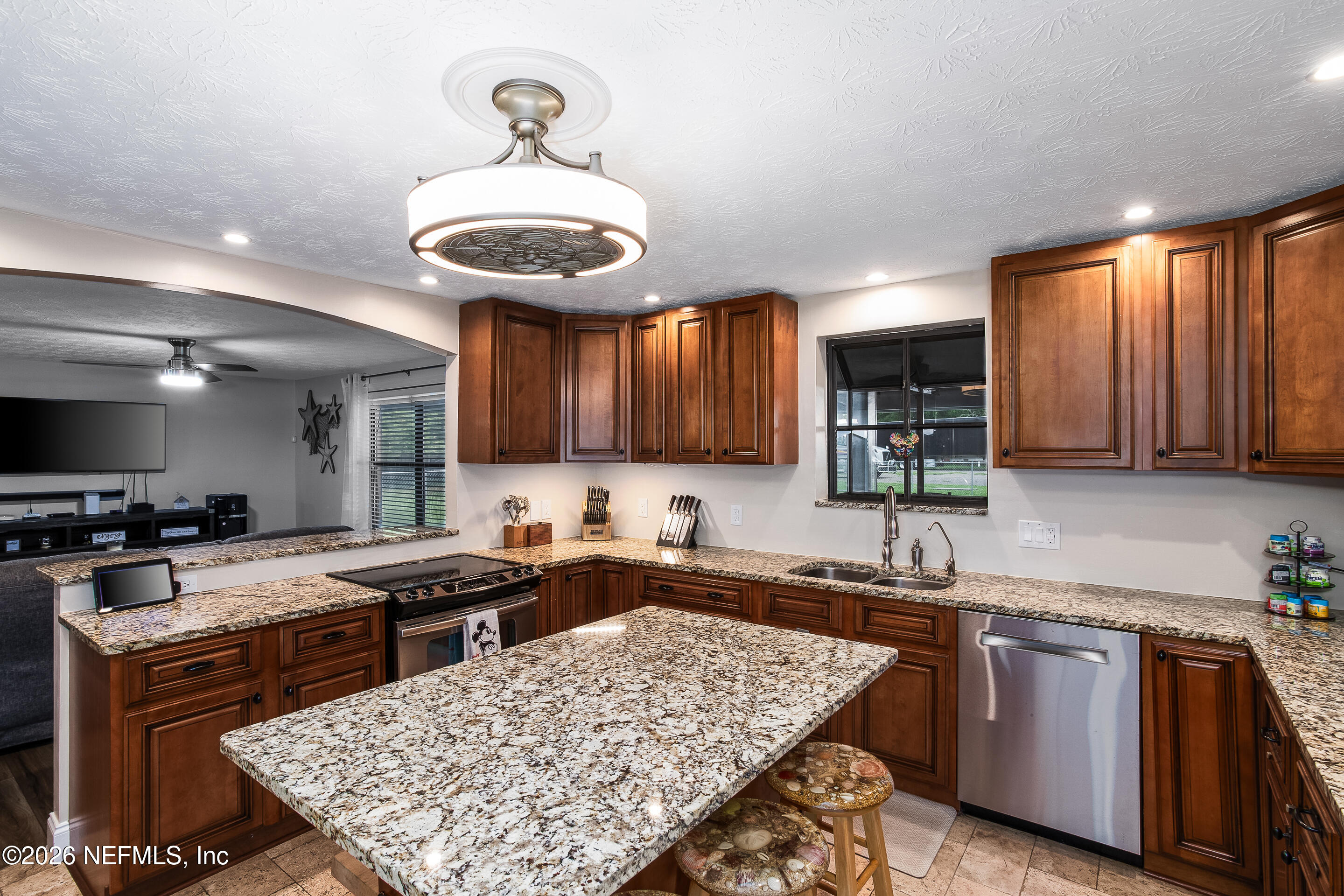 11401 Old Plank Road Jacksonville, FL 32220 - Photo 21 of 42 a kitchen with a stove a sink and a refrigerator