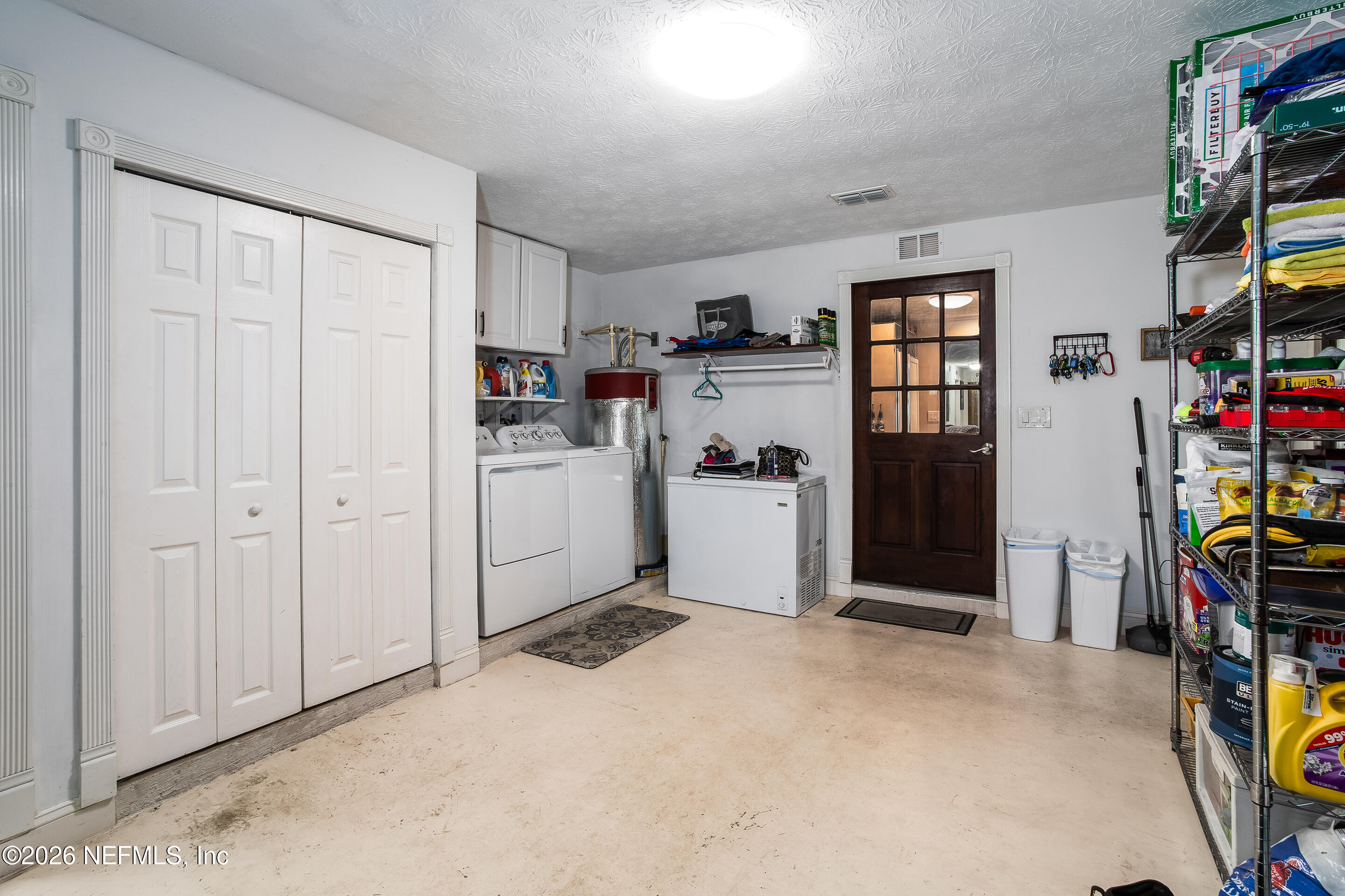 11401 Old Plank Road Jacksonville, FL 32220 - Photo 24 of 42 a view of a storage & utility room with closet fridge