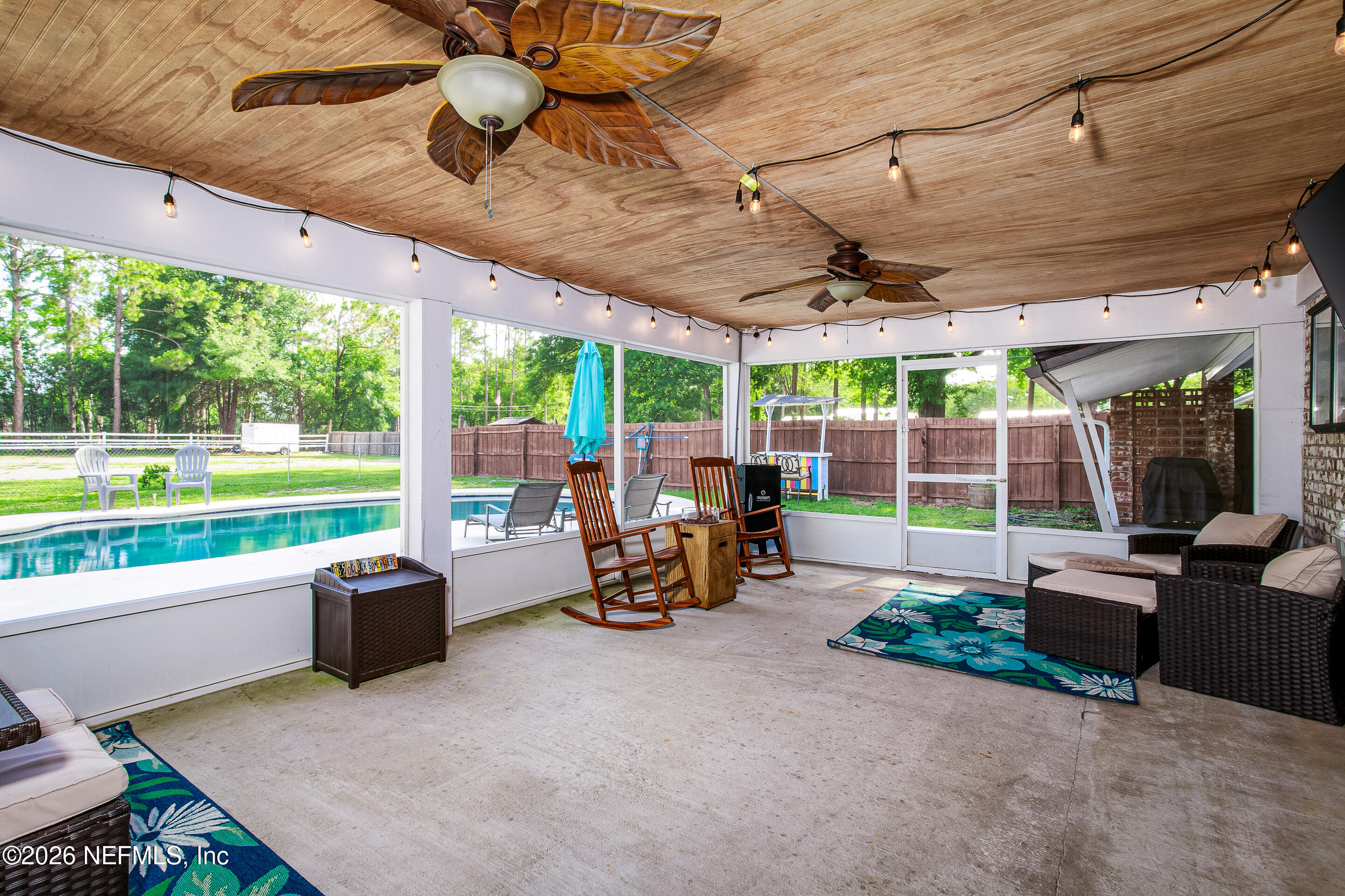 11401 Old Plank Road Jacksonville, FL 32220 - Photo 25 of 42 a view of a patio with a table and chairs