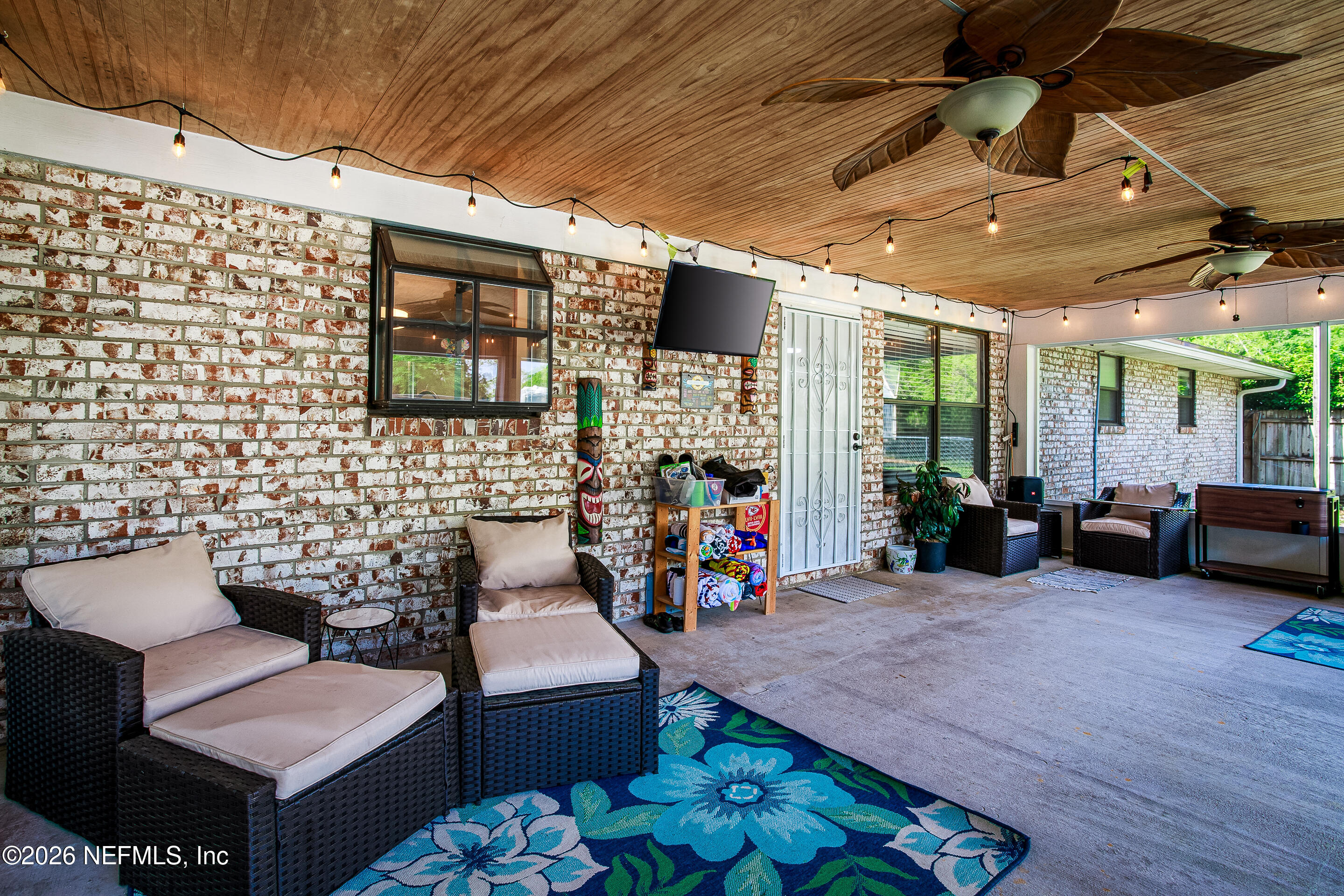 11401 Old Plank Road Jacksonville, FL 32220 - Photo 26 of 42 a view of a livingroom with furniture and a flat screen tv