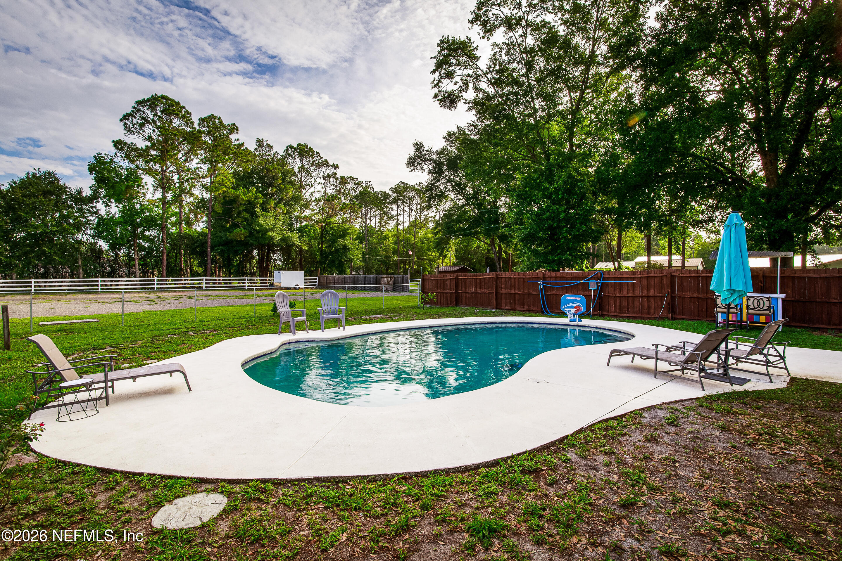 11401 Old Plank Road Jacksonville, FL 32220 - Photo 27 of 42 a view of a swimming pool with a patio