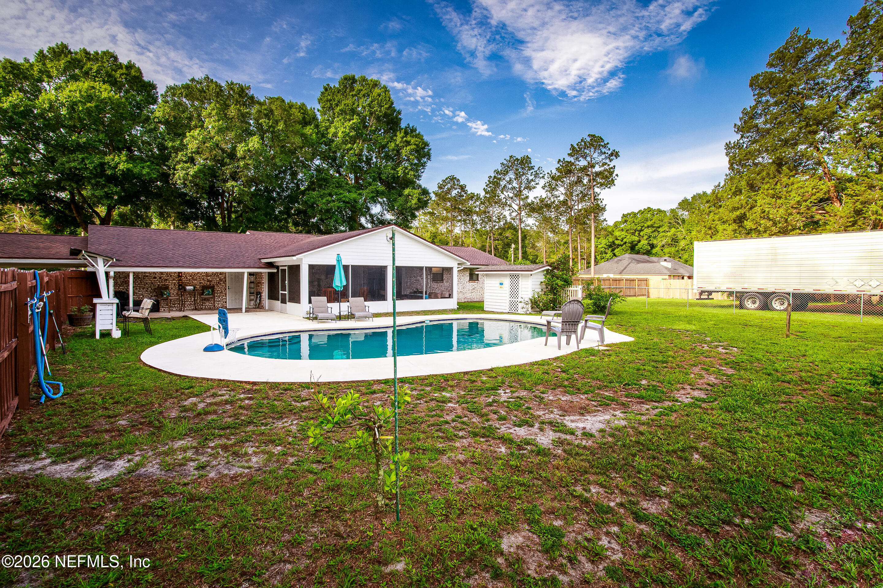 11401 Old Plank Road Jacksonville, FL 32220 - Photo 29 of 42 a view of a house with swimming pool and a yard
