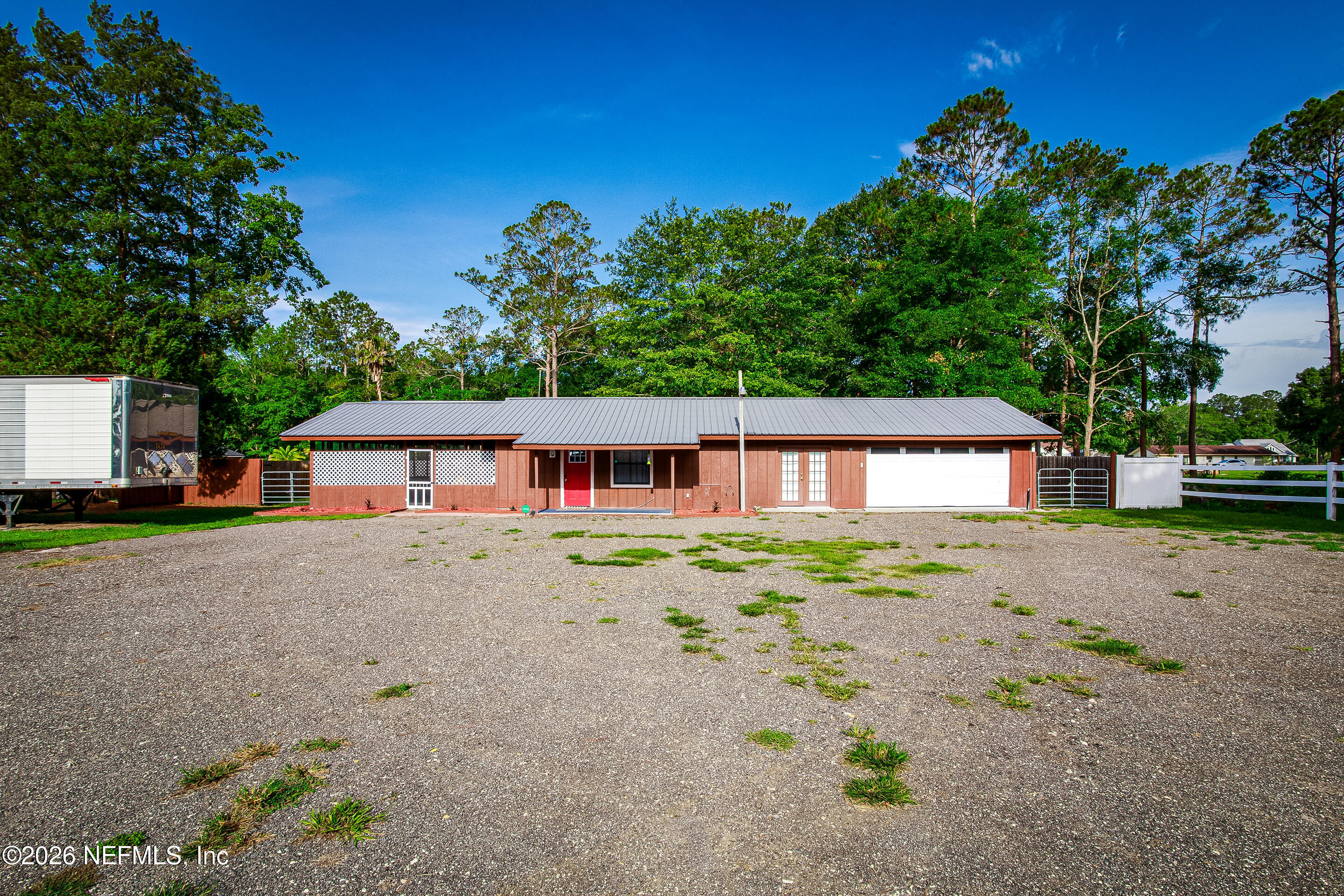 11401 Old Plank Road Jacksonville, FL 32220 - Photo 31 of 42 a front view of a house with a yard