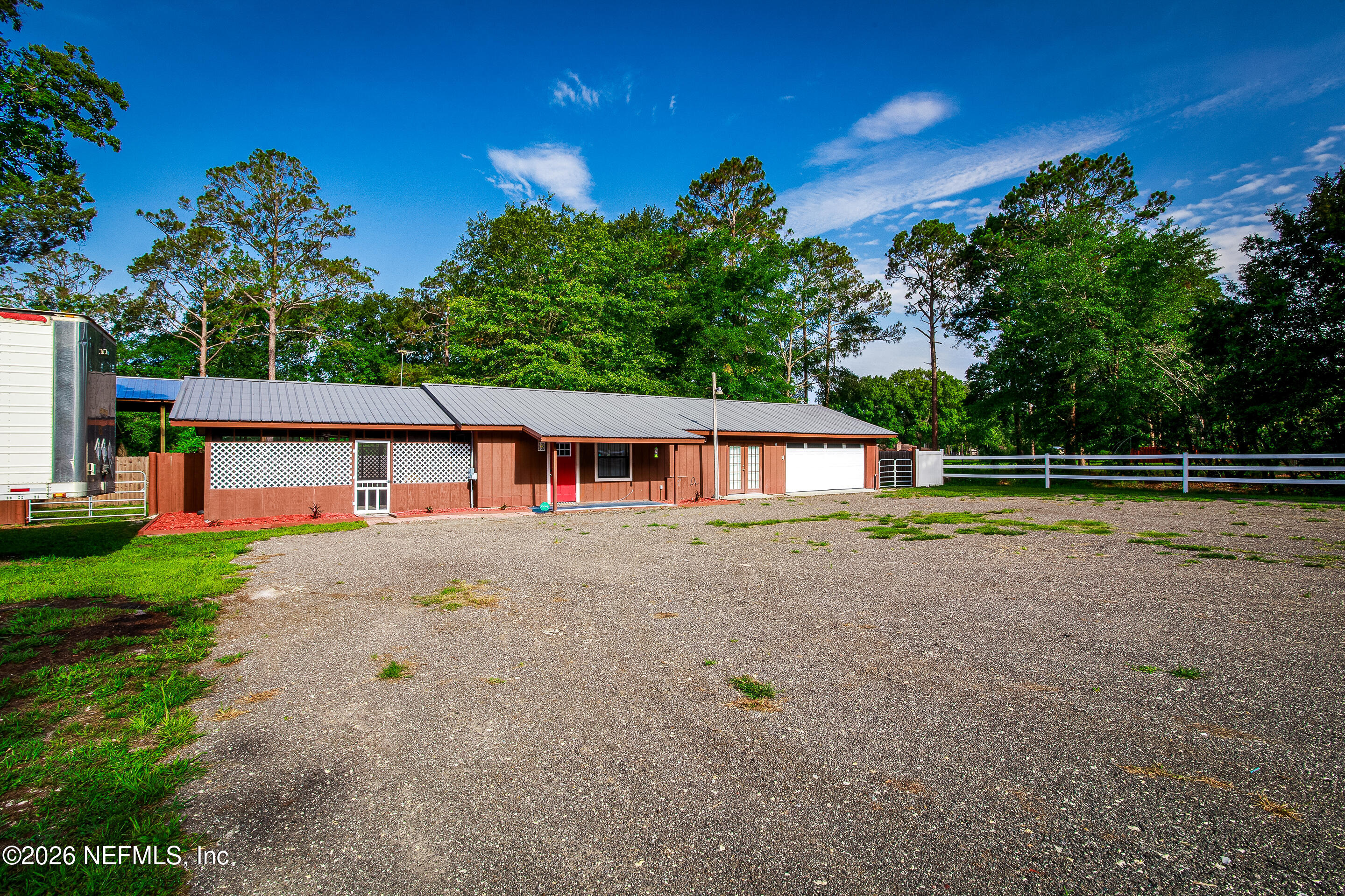 11401 Old Plank Road Jacksonville, FL 32220 - Photo 32 of 42 a view of a house with a yard and a tree