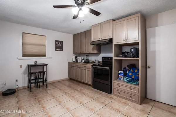 a kitchen with a cabinets and appliances