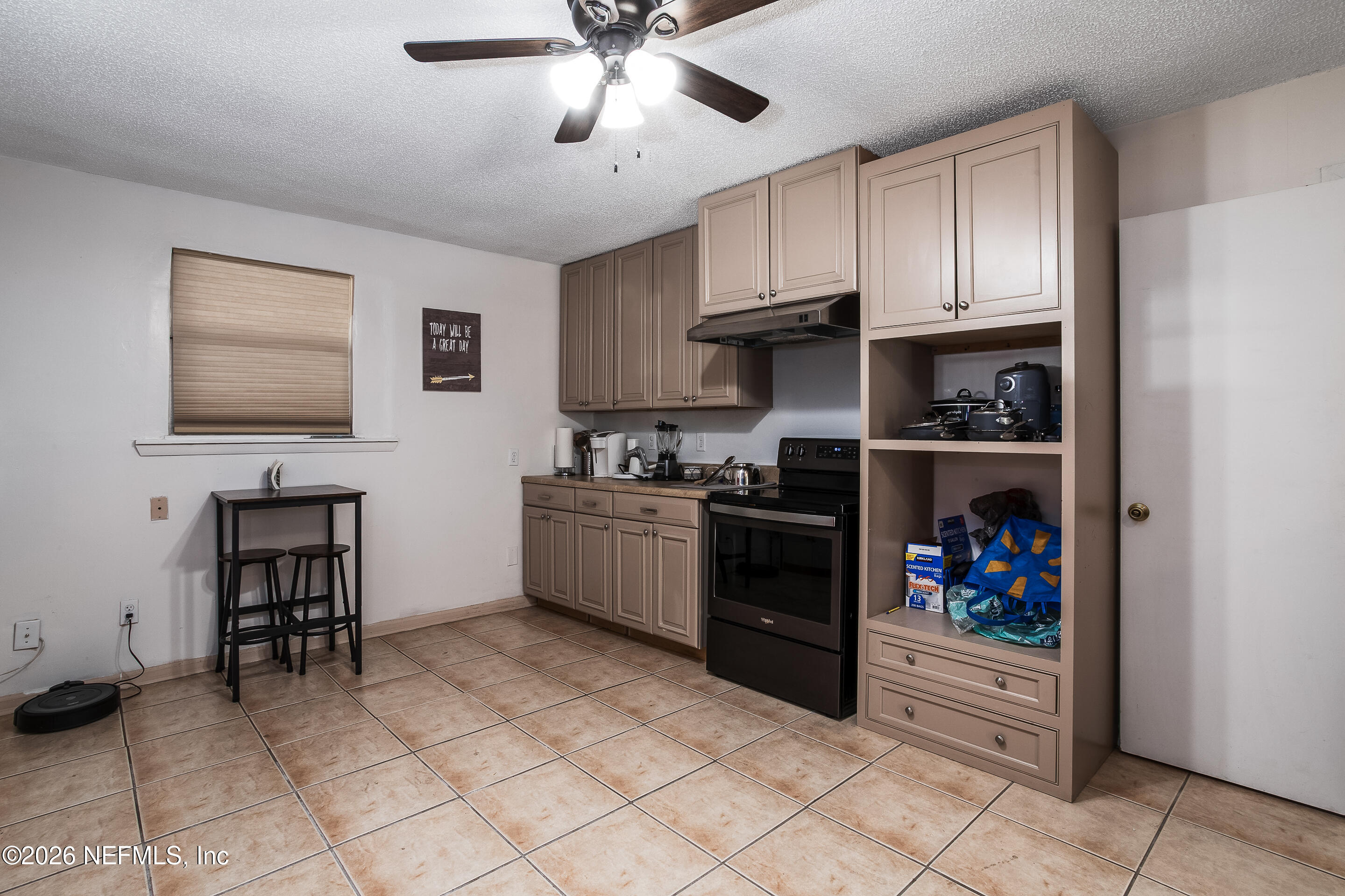 11401 Old Plank Road Jacksonville, FL 32220 - Photo 33 of 42 a kitchen with a cabinets and appliances