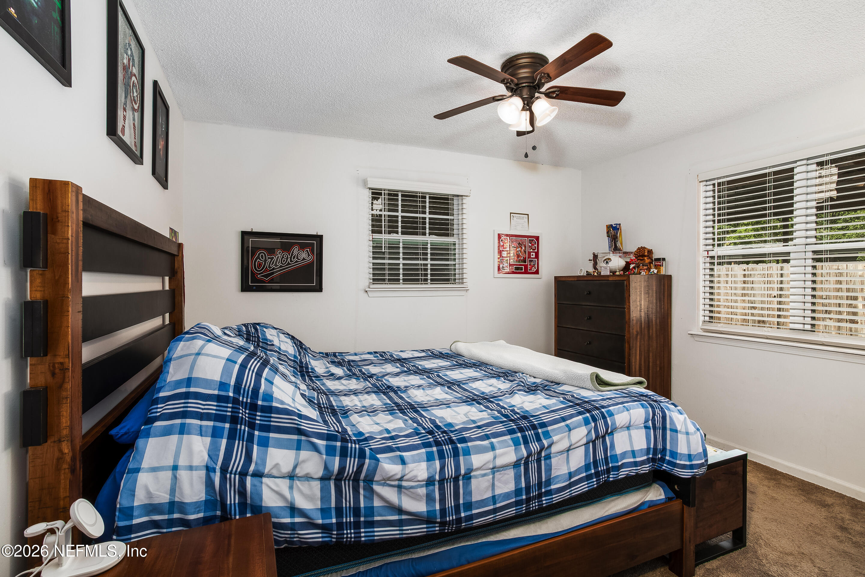 11401 Old Plank Road Jacksonville, FL 32220 - Photo 35 of 42 a bedroom with bed and wooden floor