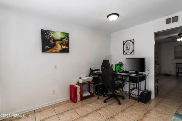 a view of a workspace with furniture